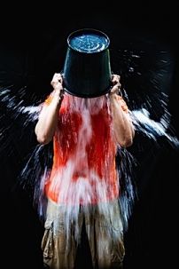 Pouring_bucket_of_water_over_head.jpg